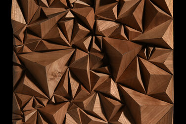 A panel with three-dimensional pyramid mosaic made of wood