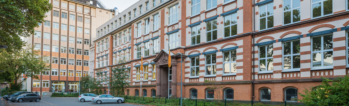 Photo of the old building and the skyscraper on Sonnenstrasse across the parking lot. __ <br>View of the old building and the skyscraper on Sonnenstrasse across the parking lot.