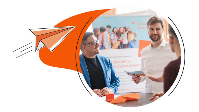 A graduate in a blue jacket talks to a counseling person at a booth advertising the International Career Service; next to it is a stylized depiction of a soaring paper airplane.