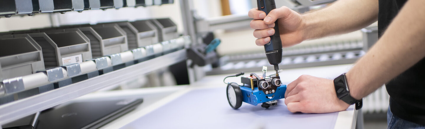 Photo of a detailed view of the screwdriving process for assembling a demonstration product in the Lean Lab.