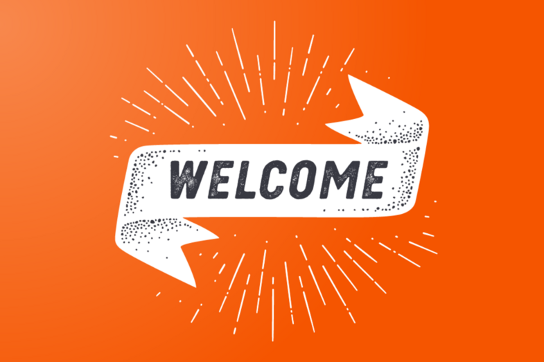 Ribbon on an orange background with the word "Welcome" on it.