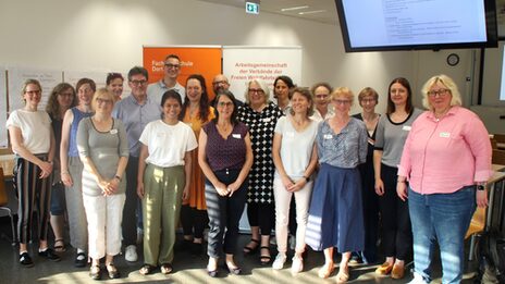 Group photo of the participants in the meeting between the AGV and the FB8