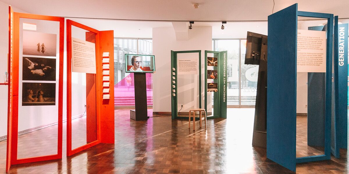 Multicolored exhibition areas in a museum space.