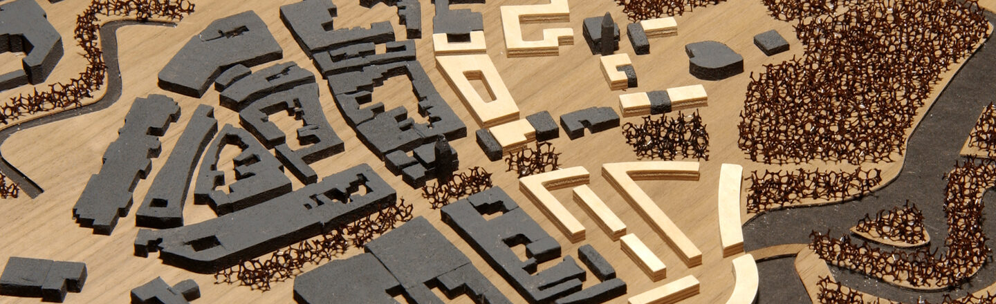 View of an urban planning model with various buildings and surrounding structures