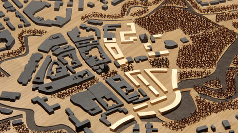 View of an urban planning model with various buildings and surrounding structures