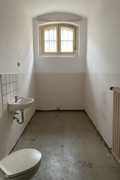 View from the front door into an empty prison cell